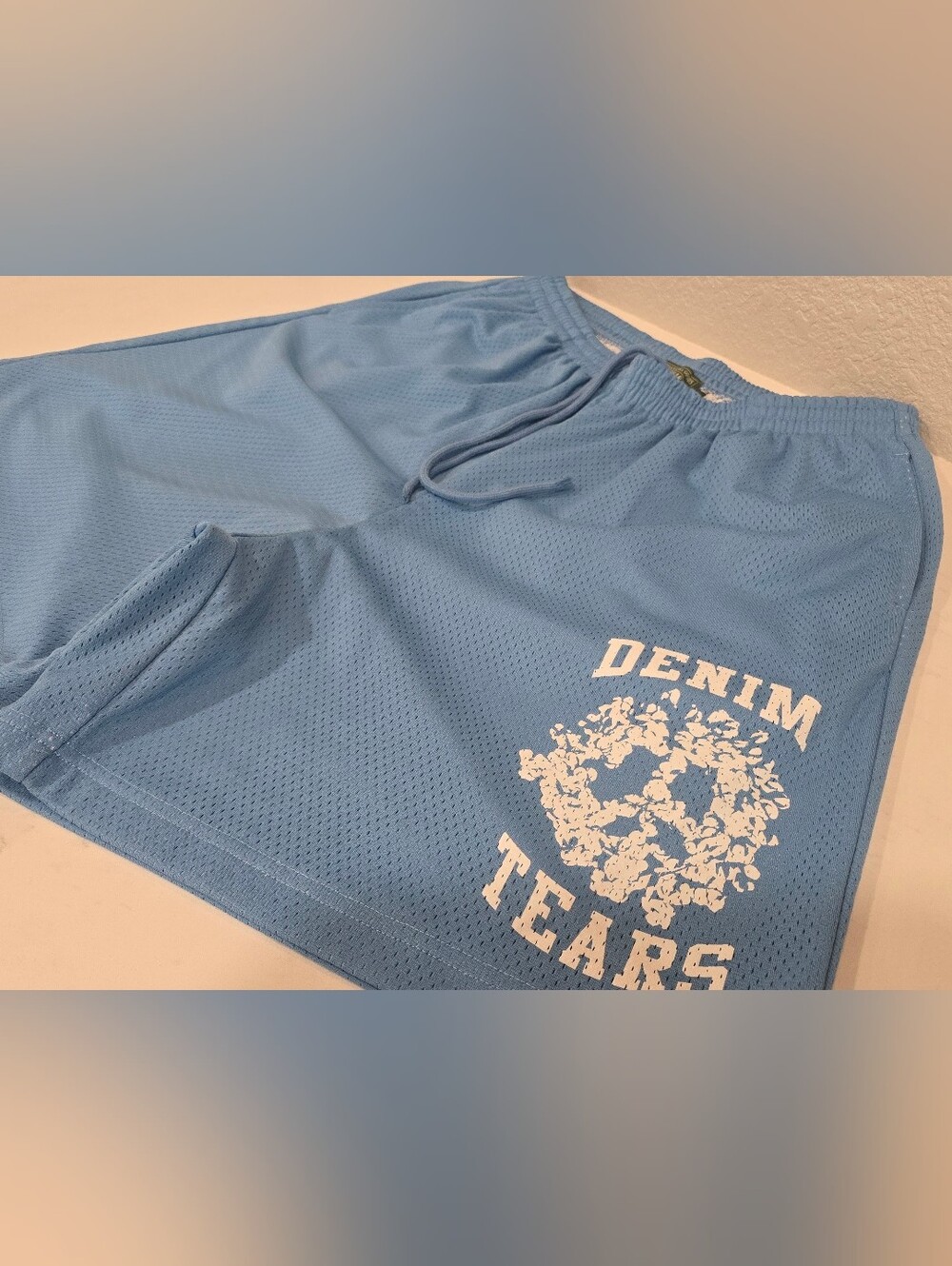 DENIM TEARS - DENIM UNIVERSITY MESH SHORTS - Light Blue